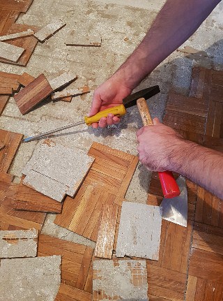 Removing glued hardwood flooring